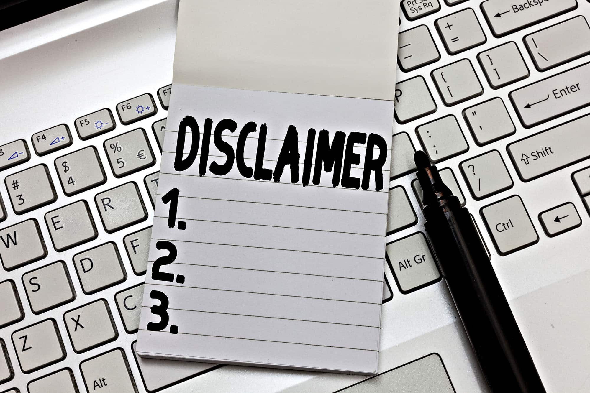 Blank disclaimer note on keyboard for business guidance