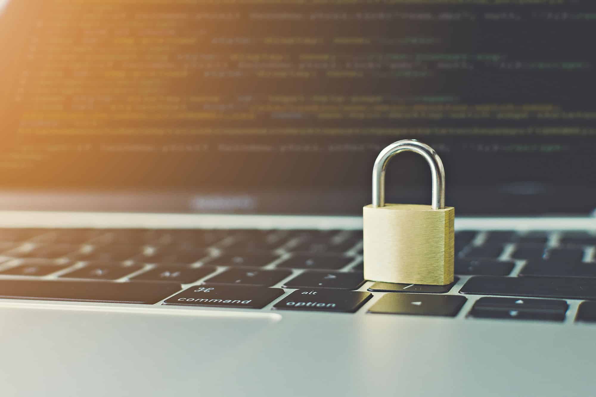 Secure laptop keyboard with padlock symbolizing data protection